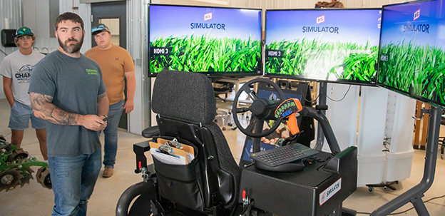 Students using tractor simulator